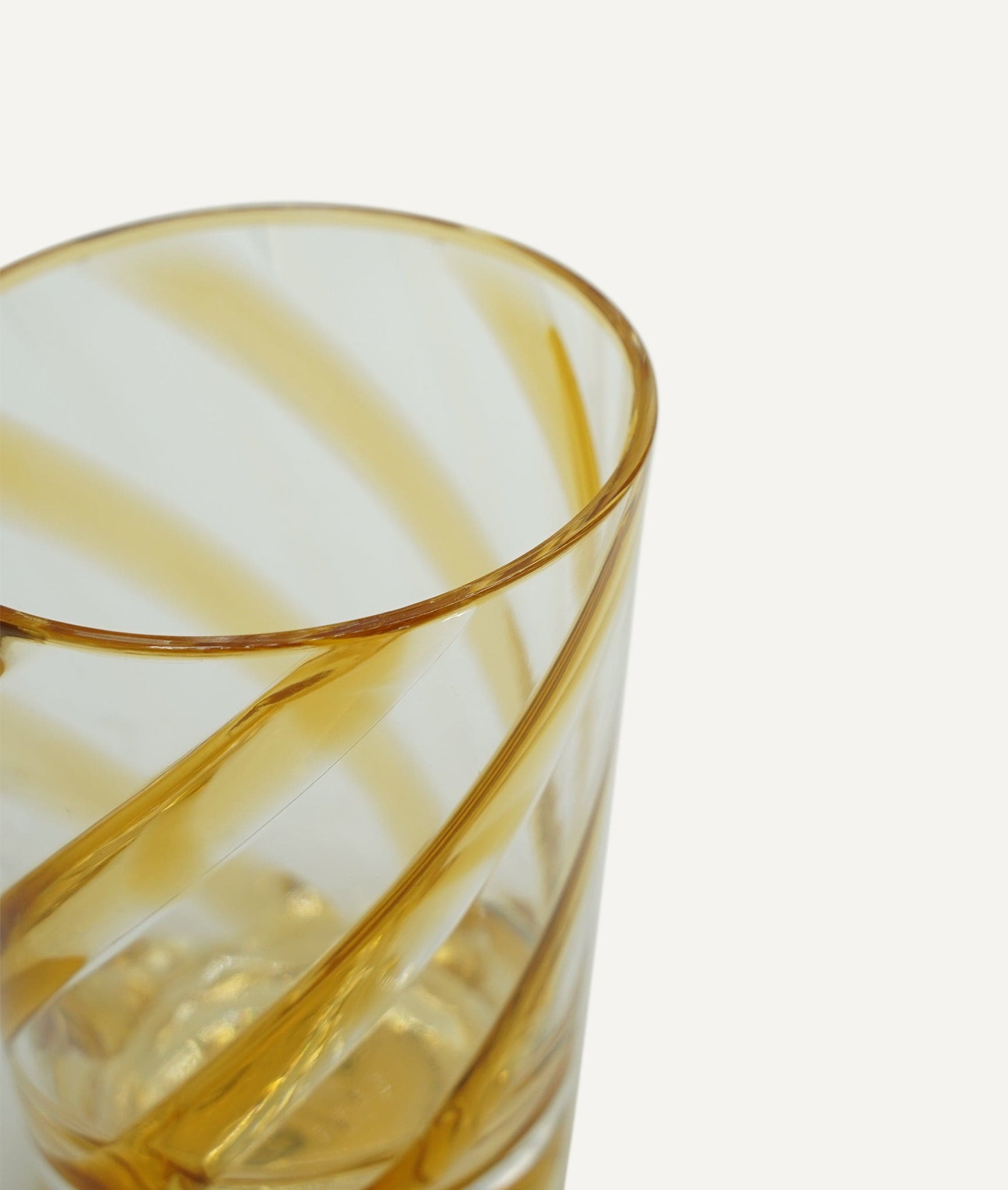 Glass - transparent with mustard spiral decoration in methacrylate