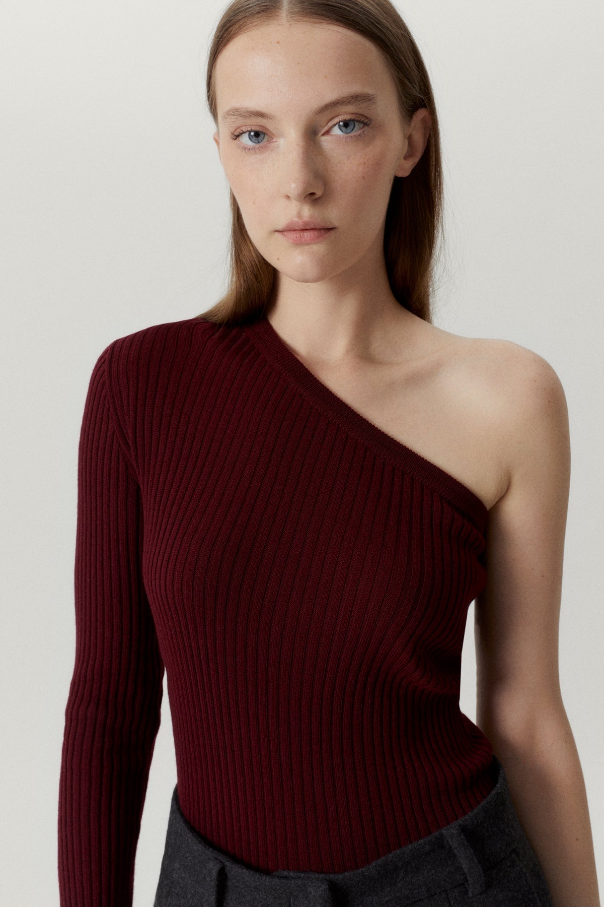 the merino wool one shoulder top ruby red